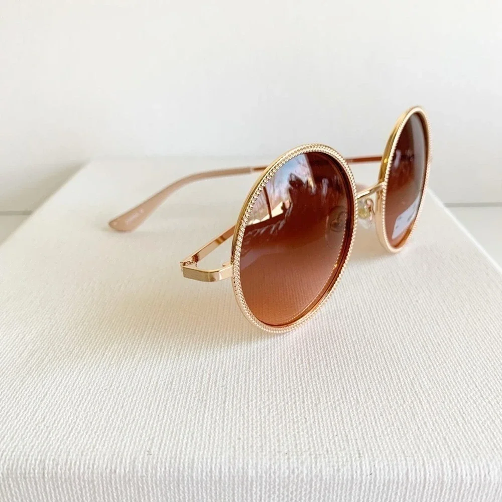New with tage FGX rose gold round sunglasses
